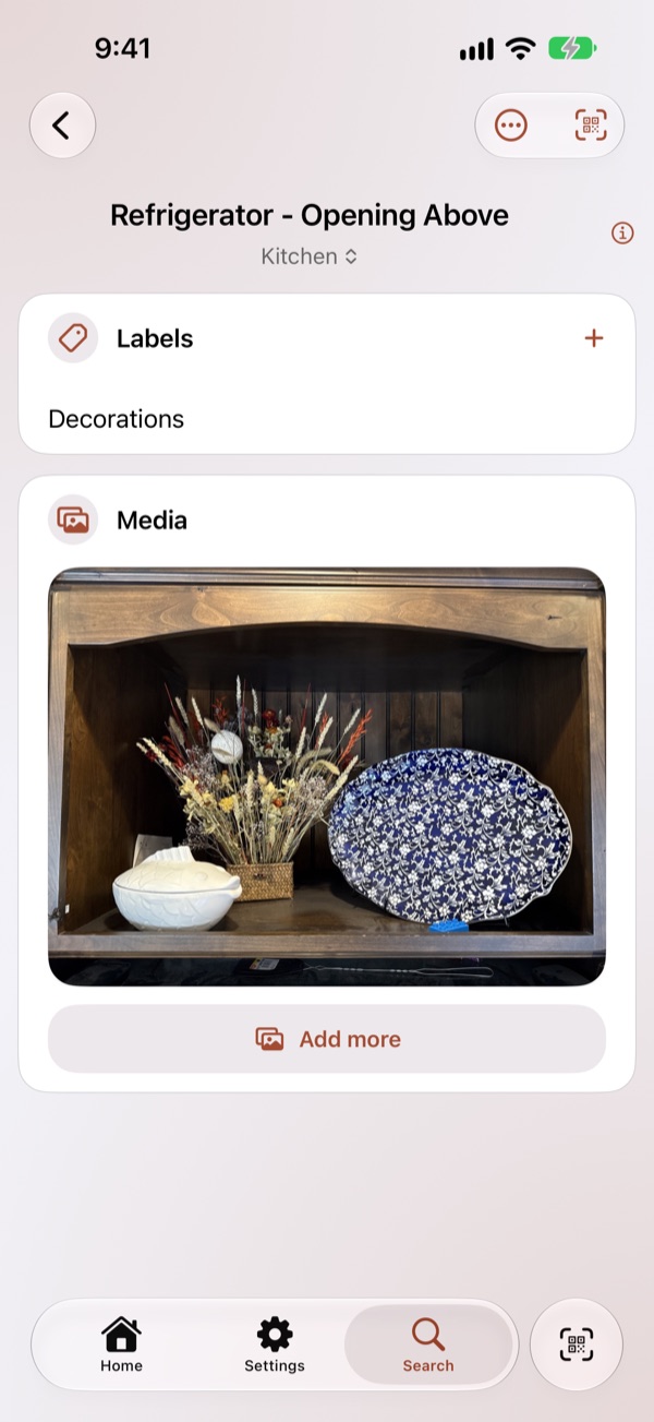 A tile's page: its photos, its labels, and the QR code stuck on the drawer.